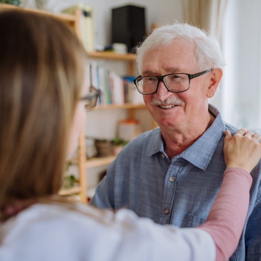 The Timberley | Smiling senior man with a caregiver