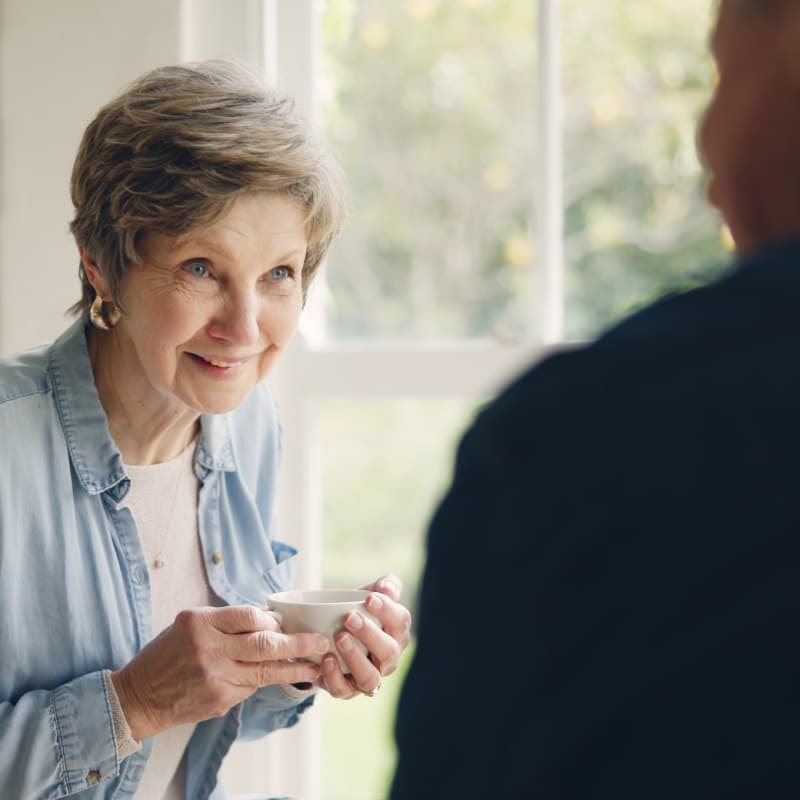 The Timberley | Senior woman talking with caretaker