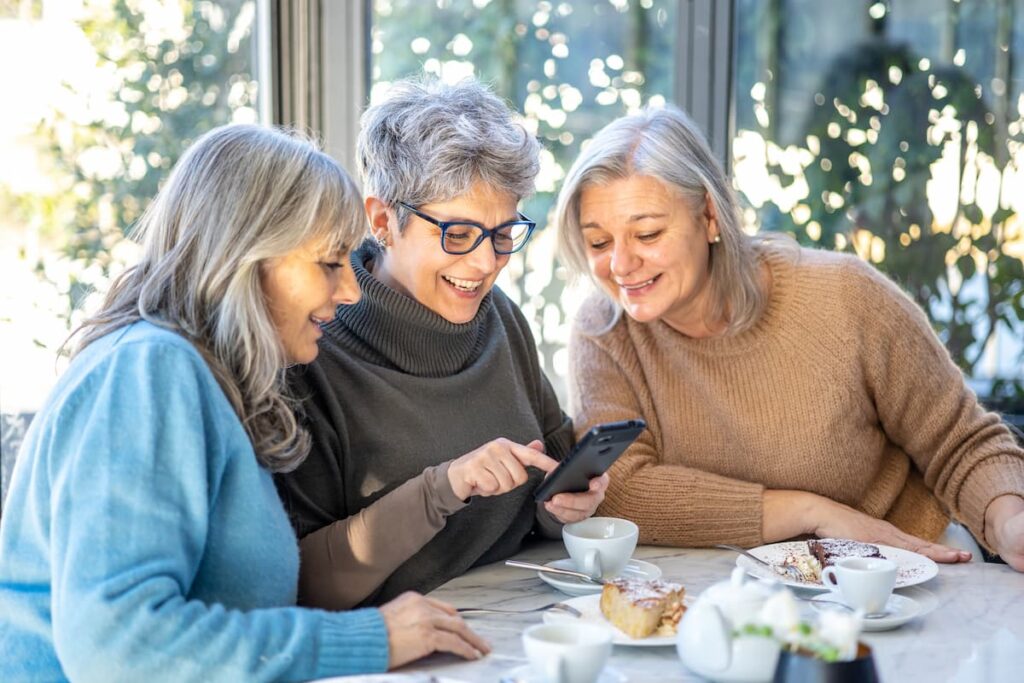 The Timberley | Senior women looking at their phone